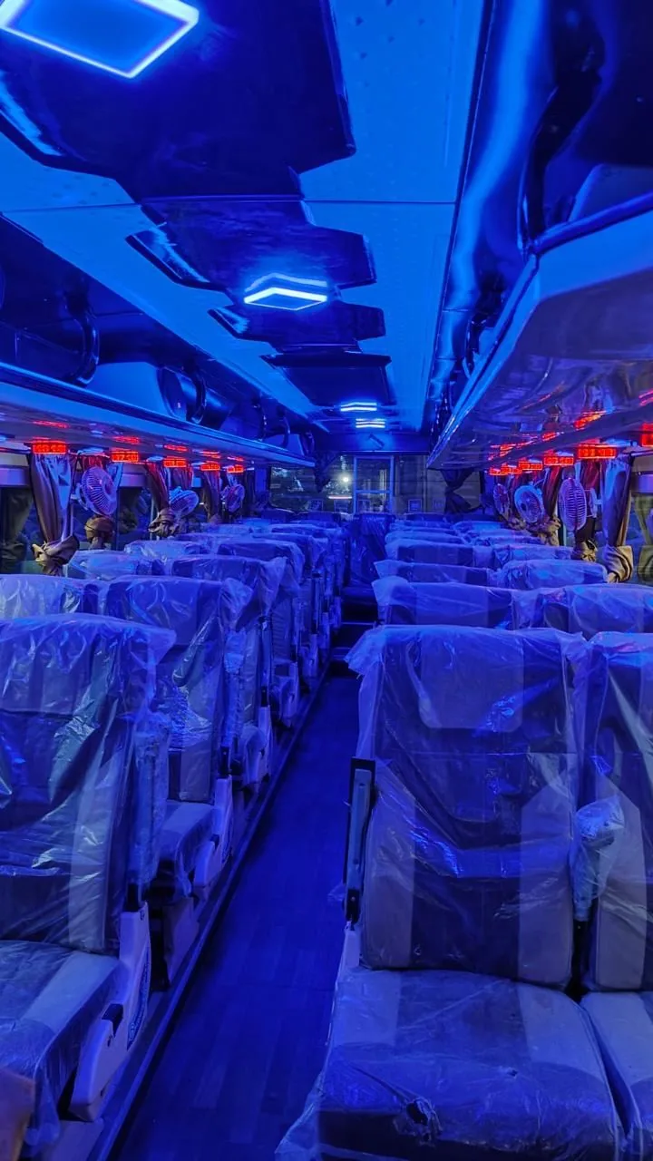 Air-conditioned interior with reclining seats and ambient lighting